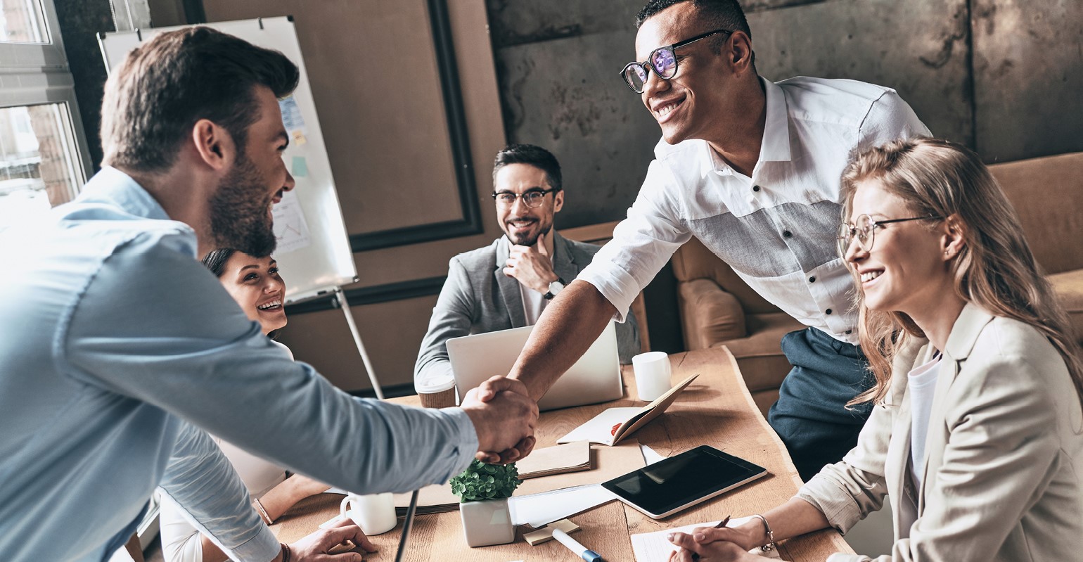 finance-agency-team-members welcoming a new team member